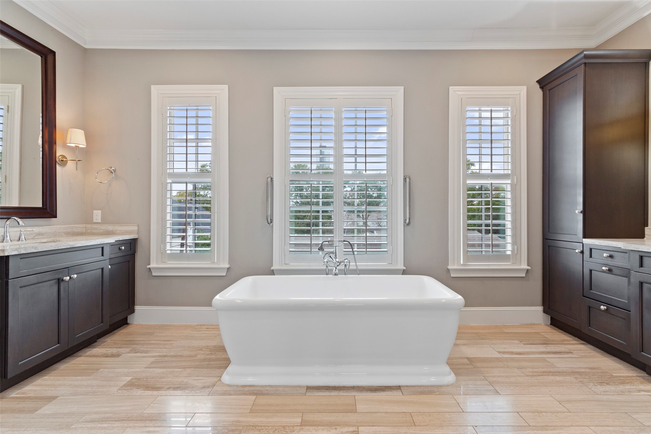 If you are looking for a stunning and functional primary bath, this is it. This large soaking tub with tree top views is just the beginning!
