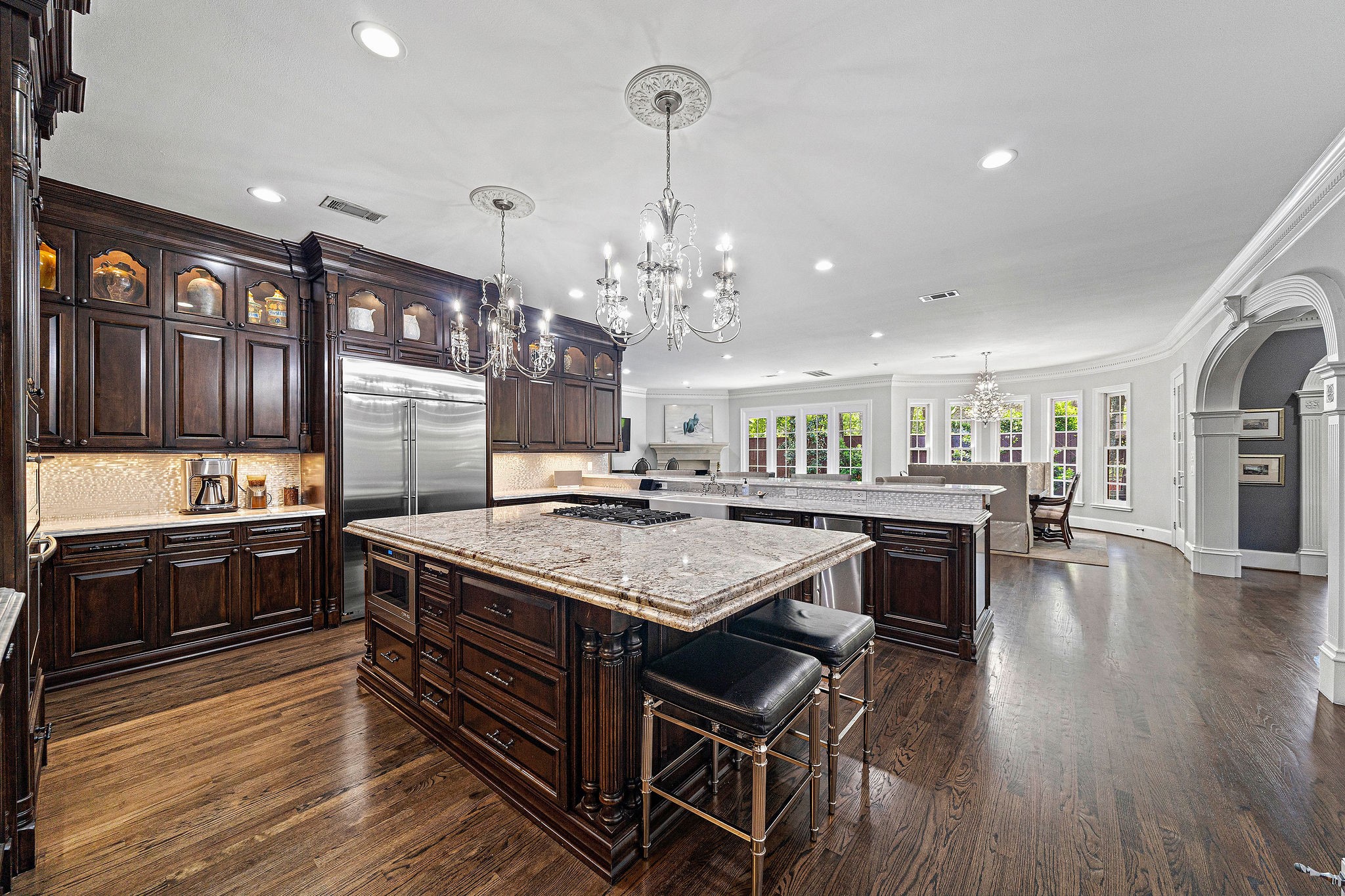 The Monogram built-in refrigerator, Shaw farmhouse sink, trash compactor and crushed ice maker are the finishing touches in this dream kitchen.