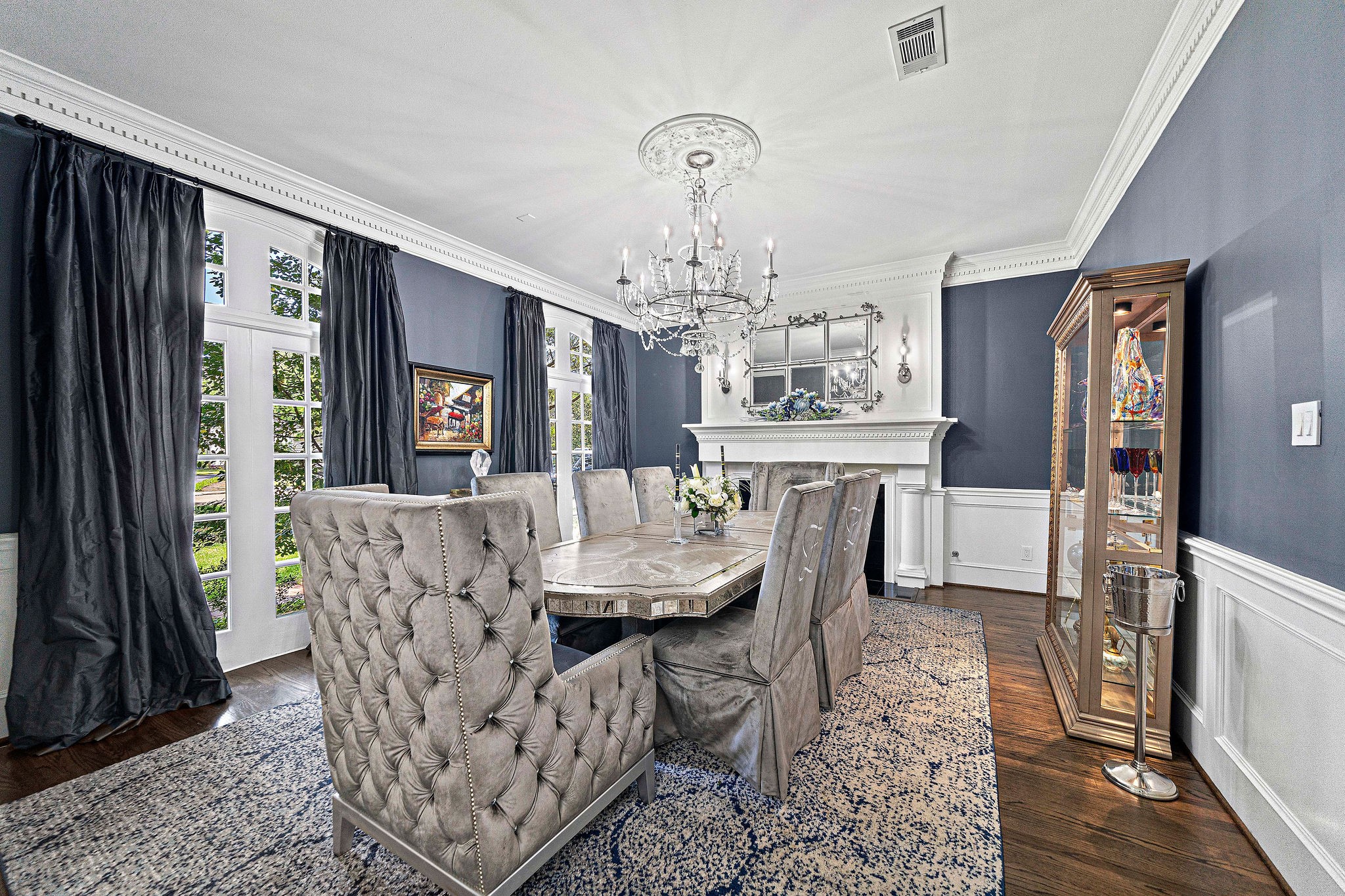 The stately fireplace and special-order chandelier are the finishing touches to this gorgeous room.