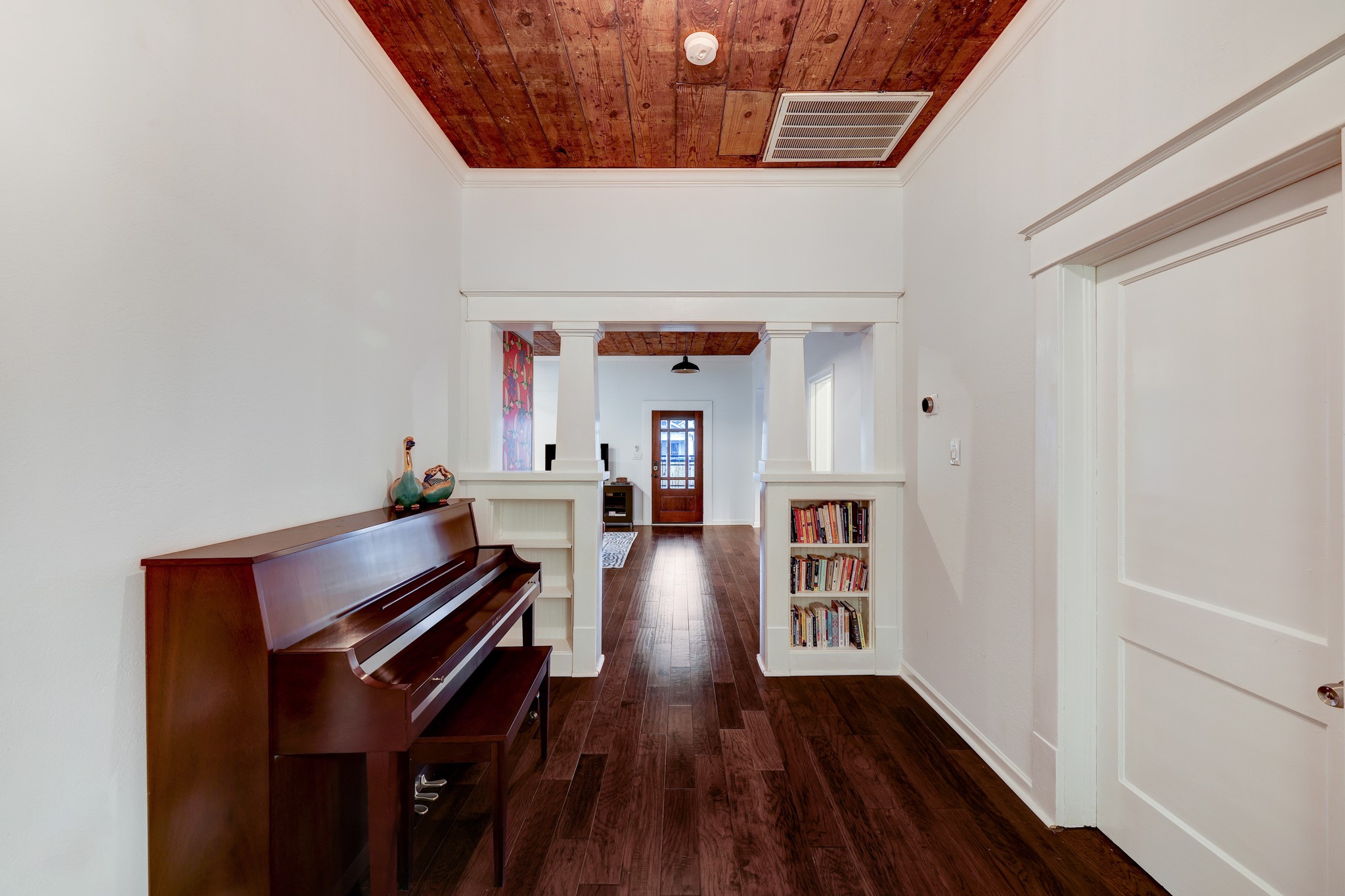 This nook with original craftsmen built-ins can flex into a reading room, office space, endless possibilities! Behind the door to the right is a secondary room.