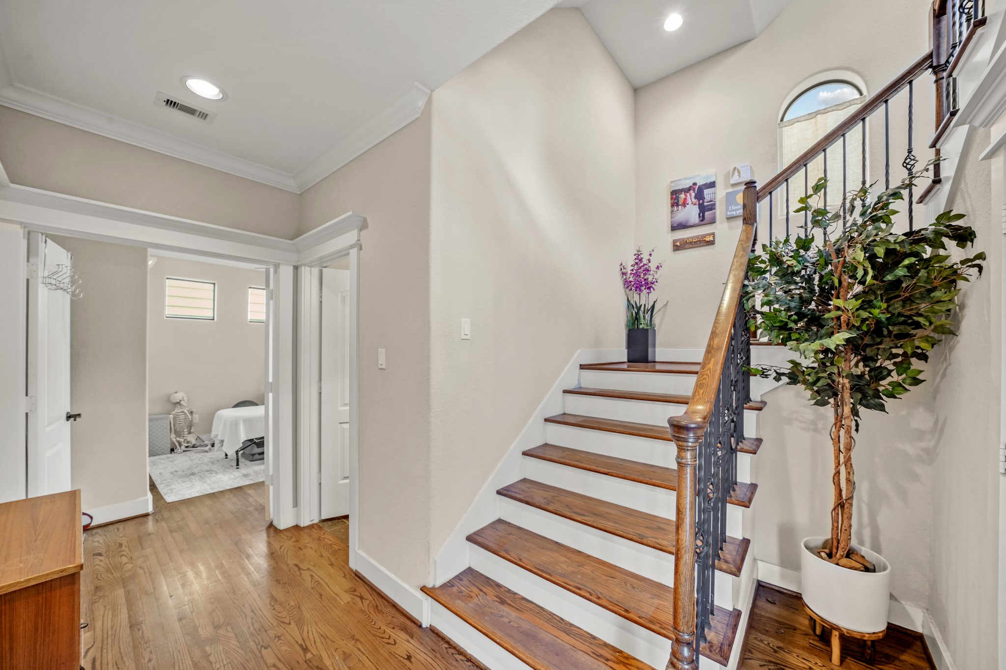 Beautiful hardwood floors and two-tone
staircase greet you as you enter the front door.