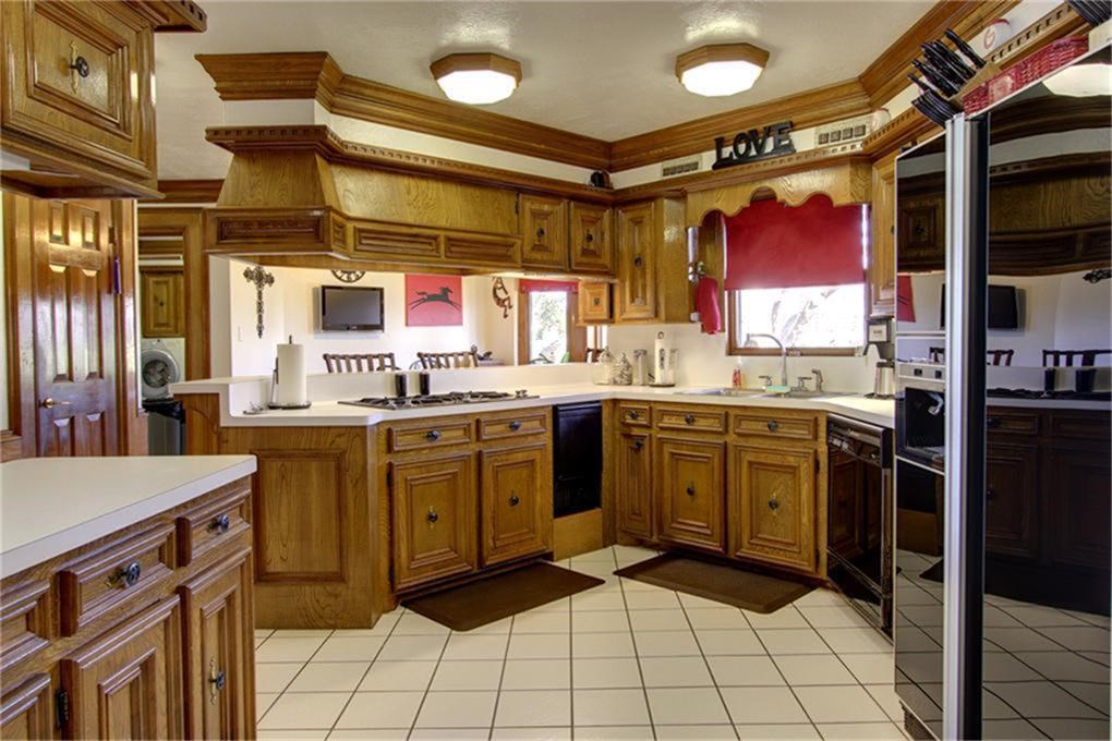 Large bright kitchen - intricate wood work throughout
