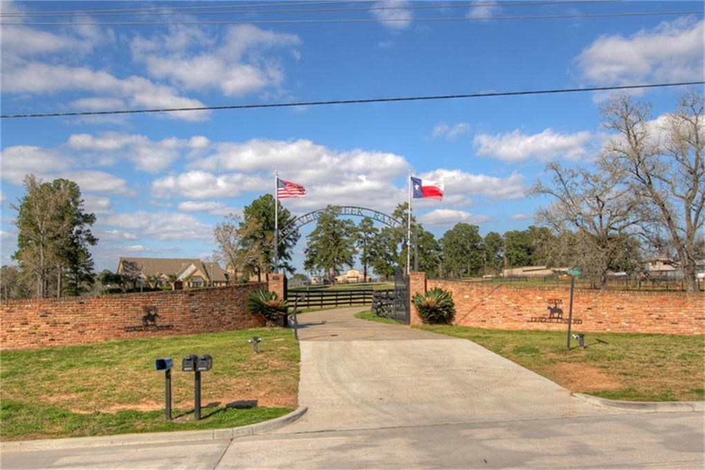 Grand gated entrance from League Line Rd. Keypad access to gate and the concrete driveway.