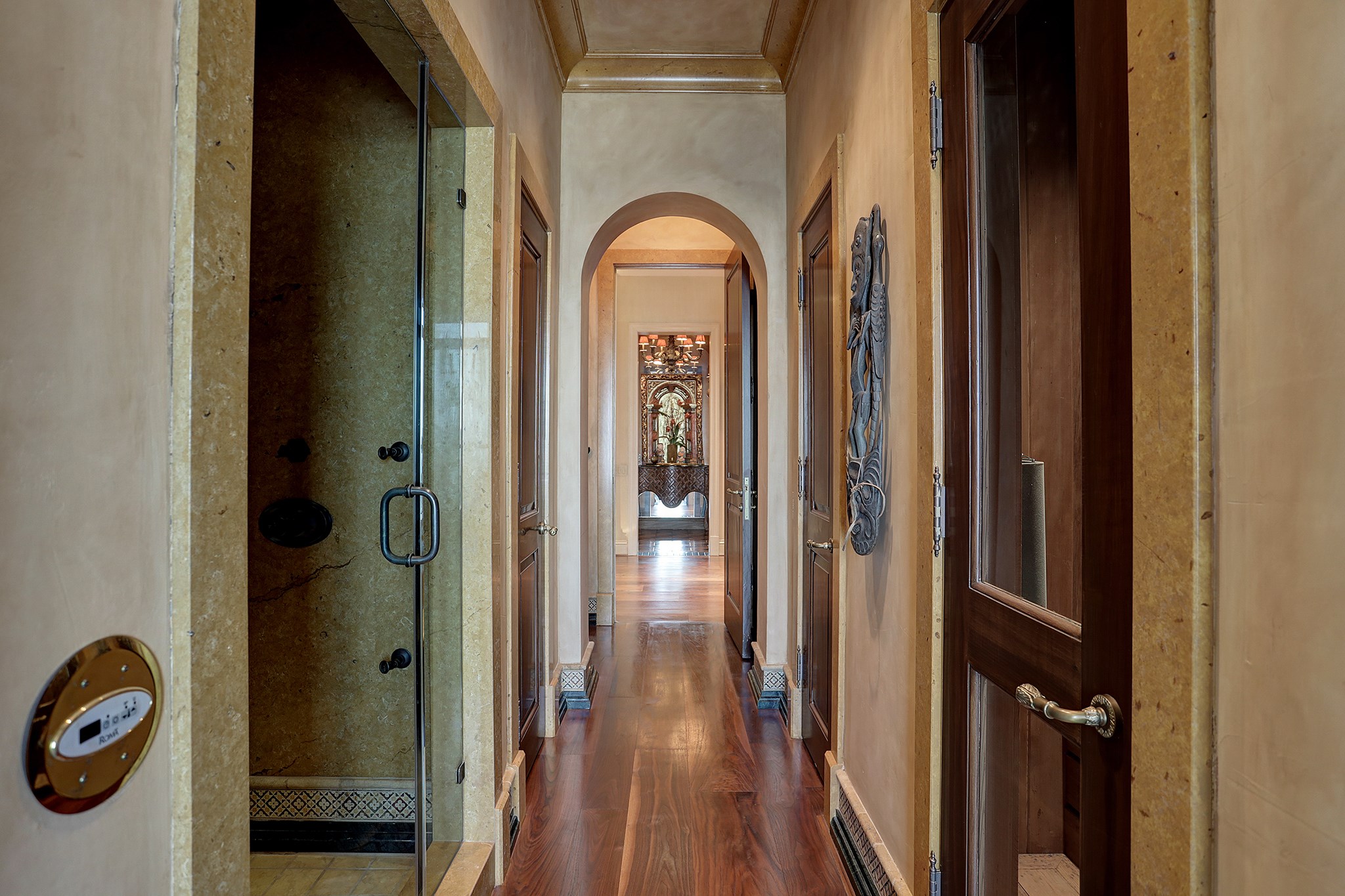 Hallway off of the Retreat that leads to the steam shower, dry sauna, oversized spa tub and two water closets