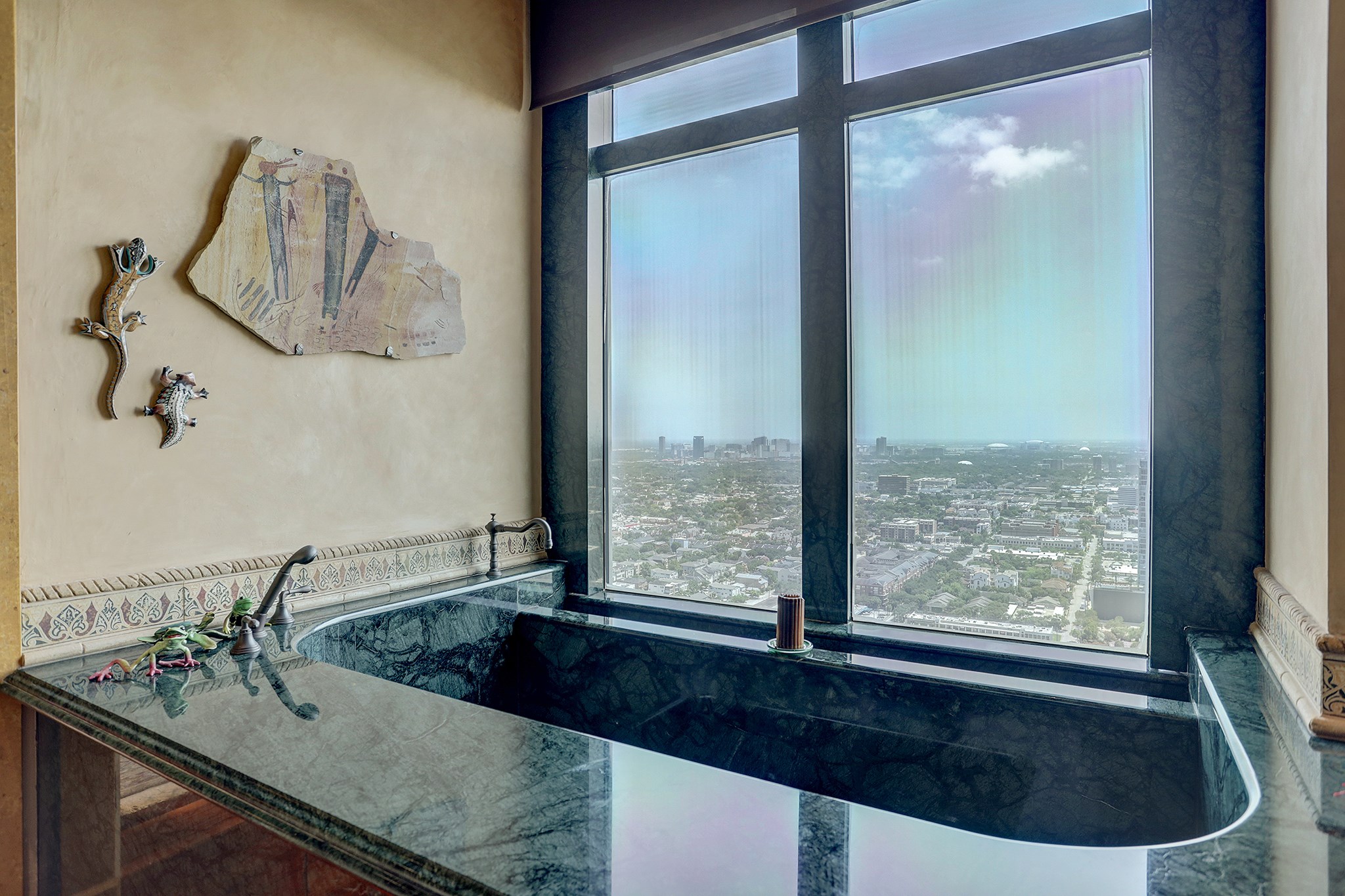 The Verde marble oversized spa tub with views.