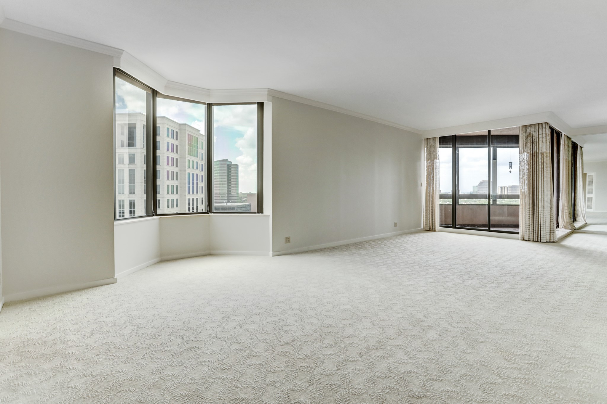 This very spacious, light filled living and dining area shows the smooth ceilings (seller removed all popcorn), fresh paint (throughout entire unit except study/office) and sweeping city views from every window.