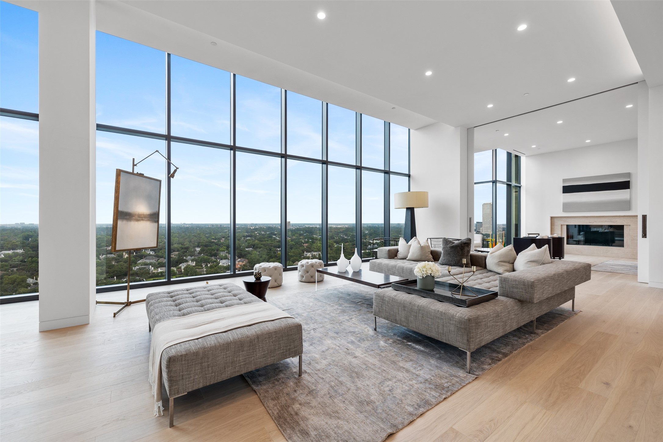 Whatever your style, this home will be a one of a kind living experience. Large, open living spaces featuring 14’ floor to ceiling windows and unobstructed views of the horizon over the gorgeous trees.