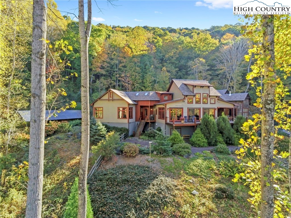 Retreat to Mountain Elegance: Discover this well thought-out & beautifully constructed home with all the modern conveniences tucked away on 56+ acres with 8 stall barn, layered VIEWS & sunsets, woods, pasture, water, & more! GREAT "work from home" with SkyBest Gigabit Fiber, CAT5 wiring, 3 wireless access pts, + Sonos music! Protected conservation land with allowance for hunting, add'l homes, guest homes, out buildings, + ability to sell two buildable tracts. Great horse property; small pond & waterfall in meadow! 3BR 3BA home has 1 level living, timber frame accents, open floor plan w/ great room & easy flow to outdoors, top notch kitchen, + 3 suites on walk-in-level including private master suite w/ office (+ large laundry/mudroom, basement w/ workshop, & 2 car+ garage). Landscaping includes koi pond, bog garden, outdoor shower, fenced dog lot, raised gardens, & paved drive! 1 outdoor & 2 indoor stone fireplaces add to rustic decor while 2nd living space + bonus room are upstairs. Amenities: new roof, floored attic, solar & geothermal (w/ radiant floor heat), generator, pro grade stainless steel appliances, abundant wildlife, & river access nearby- fishing/kayaking/tubing!