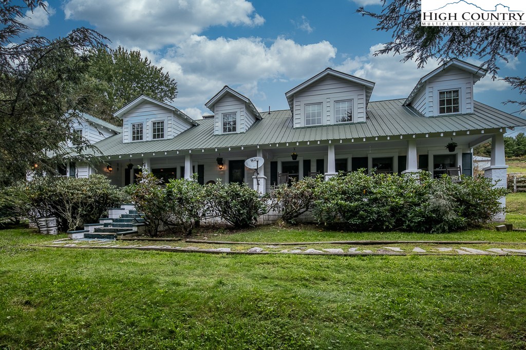 RARE FIND! Historic Banner Elk family farm. 5 BR, 4-1/2 baths in this tastefully renovated White Farmhouse featured in the movie "Where The Lilies Bloom." Former B&B. Over 3,100 sq. ft. on 3.18 usable acres. Fenced Pasture with a spring & pond, HUGE barn with stalls and hay loft plus workshop/studio/?. Wood floors through most of home, Country kitchen with custom cabinets, granite,stainless quality appliances & brick backsplashes. Cozy living room with stone fireplace. Family room with wood stove off kitchen. Oversize Master suite has bath with large custom shower,heated floors & clawfoot tub. 2 more bedrooms and full bath upstairs. 2 large ensuite bedrooms on main level. Den/office. Basement for more storage. Gorgeous views from top of property of Sugar, Beech & Hanging Rock. Major reno in 2008 with new 2 zone propane heat/AC,windows,doors, baths and more. Ideal family home, horse property or mini-farm. HUGE vacation rental potential, wedding venue or more!. 2 minute walk to Banner Elk Winery and only 2 miles to Downtown Banner Elk. 4,000 elevation. Prime location & school district. Large shed for vehicle & other storage. Easy driveway & parking for many vehicles. Owner/Agent.