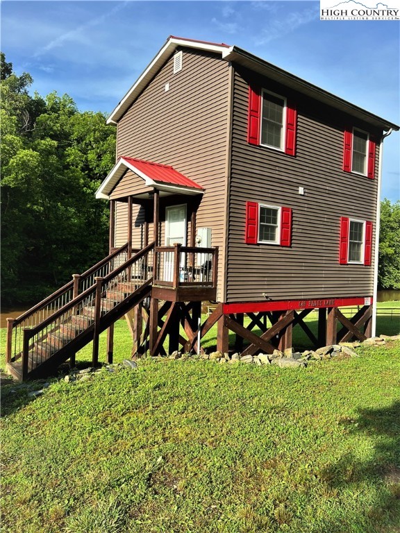 Its a HIDEAWAY ON THE BANKS OF THE NEW RIVER IN A PRIVATE SETTING! This riverfront cabin offers all the fun activities that summertime is famous for here in the mountains. Fishing, tubing, kayaking, family cookouts with cornhole and so much more!  The design is simple with modern touches in a traditional setting -2 bedrooms and 1 bath with hickory cabinets, wide plank pine flooring, Shaker style interior. Both of the decks display spectacular views of the New River.  Nearly maintenance free exterior so you can spend your time on what is important---relaxing.....Schedule your showing today!