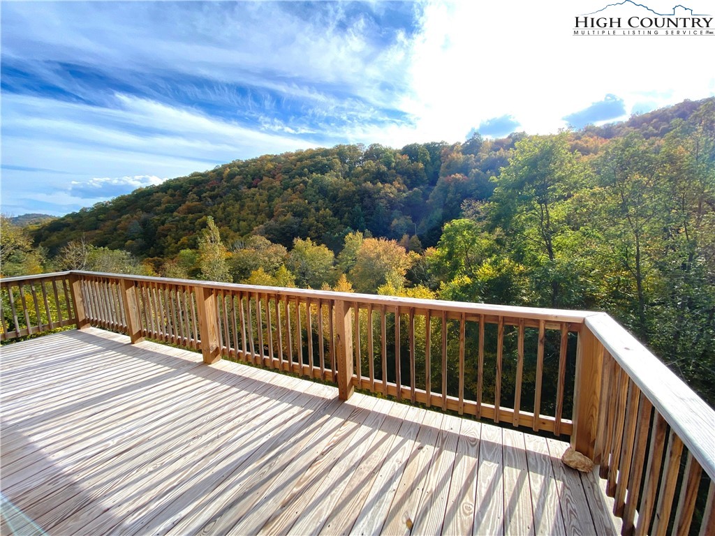*DEADLINE FOR ALL OFFERS TO BE IN - 5 PM SATURDAY 11/12/22.* Charming cottage with views in Blowing Rock that ALLOWS SHORT TERM RENTALS! Being sold AS-IS! A fixer-upper for some, but currently very livable. Affordable cottage nestled in a quiet community in a GREAT location just 6 minutes to downtown Blowing Rock, 7 minutes from Appalachian Ski Mountain, & 5 minutes to Boone with easy access off of Highway 321! This two-bedroom, three-bath dwelling currently operates as a three-bedroom home (with 2 BR septic permit) and offers a bright main living area with cathedral ceiling & bonus living space in the finished lower level. This cottage will make a great year-round home, mountain getaway, or investment property close to all the High Country has to offer!