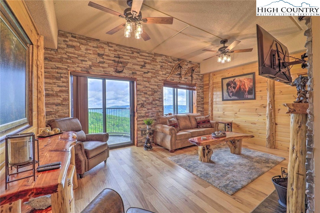 Come fall in love with this beautiful and truly unique unit!  With its remodeled cabin interior, as well as spectacular views of Sugar Mtn. and beyond, this unit offers a mountain home feel with the convenience of all the amenities Sugar Top has to offer!  Being offered fully furnished with tasteful furniture and decor, this condo is ready to be used!  Come make this your next vacation home or investment property!