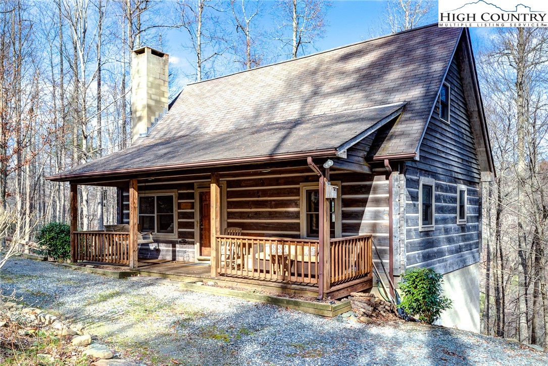 Classic log cabin ideally located between Boone and Blowing Rock. Whether it’s fall football games at Appalachian State or winter skiing at App Ski Mountain, you’re close to it all. Cabin is less than three miles to Appalachian Ski Mountain and less than four miles from Doowntown Boone or Appalachian State’s beautiful campus. This property would make an excellent short term rental or second home as it’s close to so many activities no matter the season. Inside the exposed logs and impressive stone fireplace prove a warm and welcoming place for friends and family to relax after a day exploring the High Country. The main floor features a kitchen with new granite counters that opens into the living room with a stone fireplace and vaulted ceilings. There’s also a dedicated dining area off the kitchen. The main floor is also home to a full bathroom and a large bedroom. Upstairs you’ll find a spacious loft, a full bathroom, and another bedroom. The lower level has a cozy den along with another bedroom and a bonus room. Two levels of decks provide ample space for outdoor living.