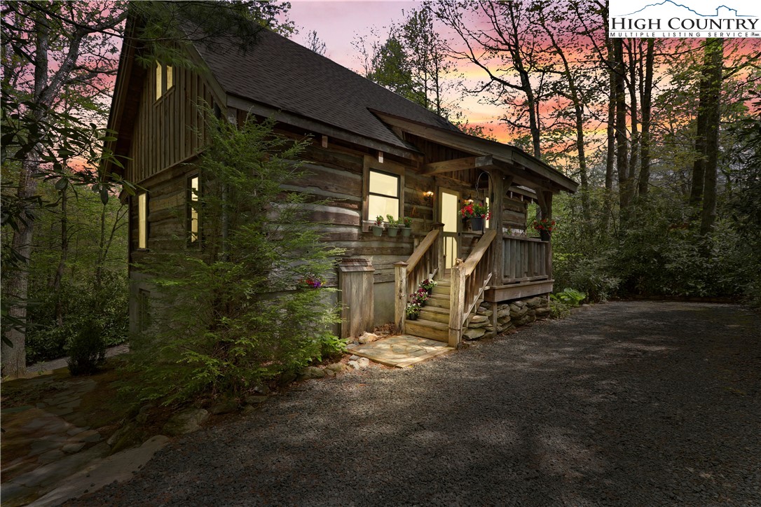 Welcome to your dream cabin located in the beautiful mountain community of Linville Land Harbor. This Appalachian log style cabin offers approximately 1350 sq ft with 3 bedrooms, 3 full bathrooms & comes FURNISHED with a few exceptions! The main level has an abundance of charm & character with unique antique doors, special lighting, a cozy gas log stone fireplace, an open floor plan with a soaring tongue & groove vaulted ceiling, a large primary suite bedroom with ensuite full bathroom. This level also has access to the large, covered deck that is the perfect place to relax & enjoy the peaceful serene setting! Upstairs is a generous sized bedroom with a full bathroom. Downstairs is another bedroom, a full bathroom & the laundry area. This private lot has plenty of parking & an oversized 1 car garage. This home is impeccable & has been meticulously maintained! New roof in 2020. A pristine community that offers recreational activities for everyone! POA fees include water, sewer, cable, internet, security, heated swimming pool, road maintenance, trash pick-up. The resort offers 18 Hole Golf Course, Tennis, Pickleball, Dog Park, Lake & River Access. Great rental possibilities!