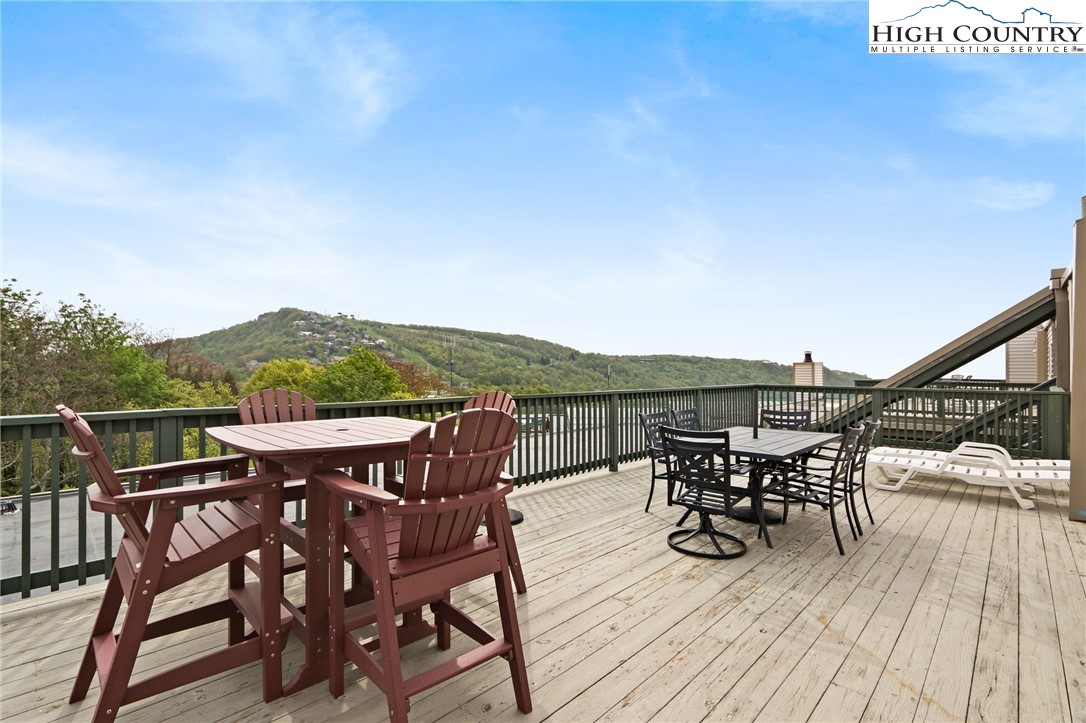 RARE GARDEN VILLA UNIT at the Pinnacle Inn Resort boasting beautiful views of the SKI SLOPES, GRANDFATHER MTN & long range views into TN!  PRICED TO SELL ! This beautifully furnished & updated GARDEN VILLA  is a top floor unit where you can STAR GAZE & relax on the expansive deck while soaking in morning sunrises & sunsets from every direction! Being sold TURN KEY & is rental ready!  Condo features 2 bedrooms , 2 full baths and the main living area is open & bright.  Being sold FULLY FURNISHED & there is a sofa sleeper in the family room for add'l guest.  The Pinnacle Inn resort is PET FRIENDLY & the location doesn't get better than this as you can walk to EVERYTHING the Town of Beech Mountain has to offer! The dog park and hiking trail is just outside your door as well as several restaurants.  HOA fees include EVERYTHING except electricity. AMENITIES galore as you & your guests will enjoy the abundant indoor/outdoor amenities such as the newly renovated Indoor Pool, HOT TUB, sauna, game area, indoor fitness area, mini golf & more! Walk to Fred's General Store, restaurants, hiking/biking trails, sledding hill, ski shuttle & more!