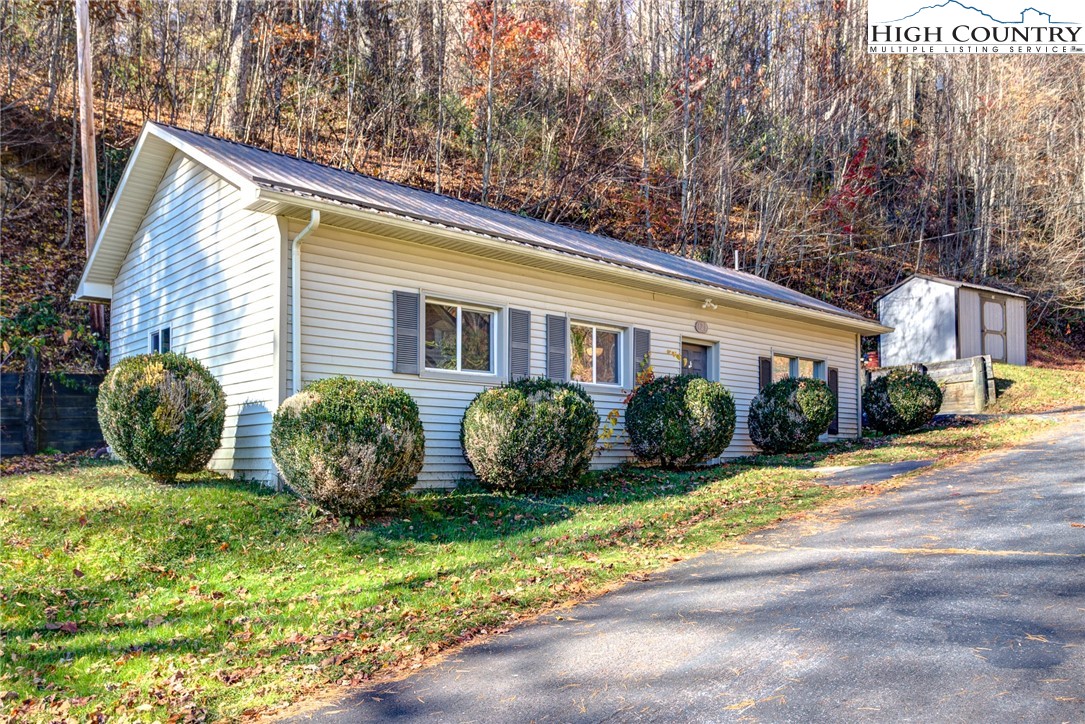 Great Investment Opportunity in Boone!! Just outside of town limits with no zoning. Well-maintained 2/1 has been a successful long term rental for many years. Great access to App State, Watauga Medical Center, Samaritans Purse and situated between Boone and Blowing Rock. Sweet little cottage with metal roof new in 2018, heat pump in 2021 and updated kitchen/bath. Storage shed does convey. Second lot has quonset building with power, water and bathroom currently used as workshop. [[Also available without 2nd lot/workshop-See MLS #246422]] Current tenants are in lease until April 2024. 24 hour notice required for showings.