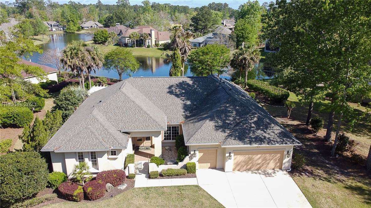 Regal Riverbend Rushmore lagoon-view home on .56 lushly landscaped lot. 2022 50-year GAF architectural shingled roof with new 6" gutter system.