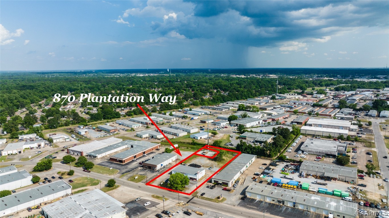 Commercial building at just under 4,500 sq ft on over an acre lot in a prime location in Montgomery!  This property has direct access off of Plantation Way.  The building features a large room with a front desk area, private office, customer and employee restrooms and a large waiting area for customers.  There is direct access to the nearly 4,000 sq ft of garage space.  The last use was a tire store but the building could serve well for a number of business needs.  There are 4 large bay doors on the front of the building and 2 large bay doors on the back of the building.  There is plenty of room for expansion as the lot is only approximately 50% occupied.  There are multiple power outlets, a storage area and a restroom off of the shop space.  Any FF&E pictured may or may not convey.  Call today for a private showing!