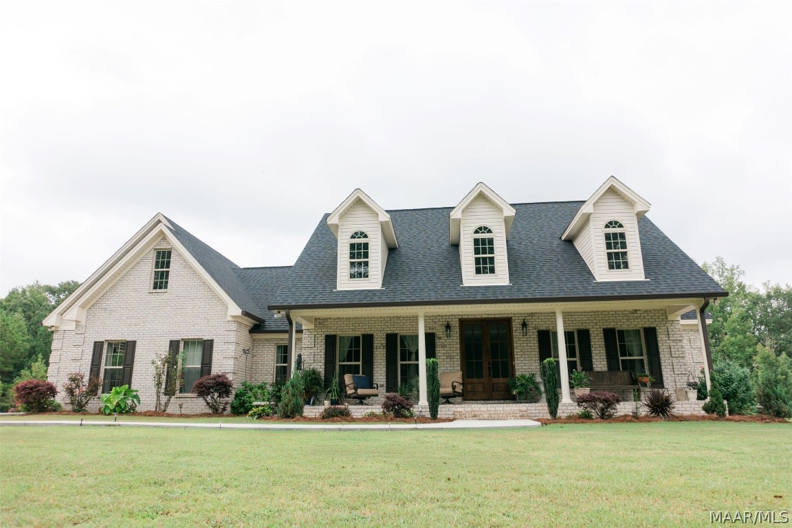 This custom-built home is located on 10.3 acres in Wetumpka. The deep porch is the epitome of southern charm, all you need is a good rocking chair and a glass of sweet tea. The foyer is a perfect-sized area to welcome you in. Upon opening the door into the foyer, you’ll find the dining room to your left, the living room in front of you, and an office to the right of you. The office can be used as another bedroom or playroom. Two more guest bedrooms and a guest bathroom is located on the right side of the home. The living room opens to the kitchen and features a beautiful stone, gas log fireplace. The kitchen offers a work island, granite countertops, a double oven, a coffee island, stainless steel appliances, a pantry, a breakfast area, and an abundance of cabinet space. The stove is wired for both gas and electric. Engineered hardwood and high-end fixtures are found throughout this home as well as all doors are handicap-accessible sizes. The master bedroom is located on the opposite side of the home with a walk-in closet and a huge, handicap-accessible shower. A spacious bonus room is located over the garage.  The laundry room is located near the garage and offers a wash sink. The heated and cooled sunroom sits off the back of the house and overlooks the beautiful land. The two-car garage has TWO attached storage spaces. One storage space is heated and cooled, so your important treasures can be stored safely. The massive, wired workshop is a handyman’s dream and offers a bathroom, two roll-up doors, and two awnings for more tractor/trailer/ATV storage. The RV pad has accommodations for 2 RVs  with electric (50 and 30 amp) and septic hookups for each RV. A second detached storage building is also located on the land and is finished but not hooked up. The stocked pond spreads across the back of this land, see pictures for details.