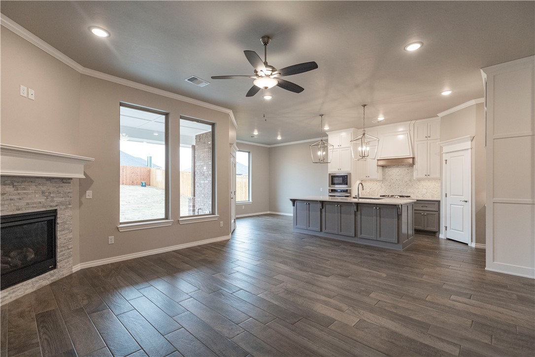 Price Improvement! Our building costs have come down & we are passing those savings along to our customers w/ this new price. Was: $469,990 Now: $447,340. This Louis Bonus Room includes 2,740 Sqft of total living space, which features 2,500 Sqft of indoor space & 240 Sqft of outdoor living space. There's also a 620 Sqft, 3-car garage installed w/ a storm shelter! Home has 4 beds, 3 baths, & a lovely pond view! Living room holds a 10-ft ceiling, a corner gas fireplace w/ a stacked stone detail, & 3 windows. Kitchen has a large island, stainless steel appliances, a corner pantry, 3 CM countertops, & cabinets to the ceiling. The main suite features a boxed ceiling detail, a large window, plus a ceiling fan. The main bath has separate vanities, a Jetta tub, a walk-in shower, & a HUGE walk-in closet! The back patio is extended by 2-feet & holds a wood-burning fireplace, a tv outlet, & a gas line for your grill! Home also has smart home technology, a Rinnai tankless water heater, & more!