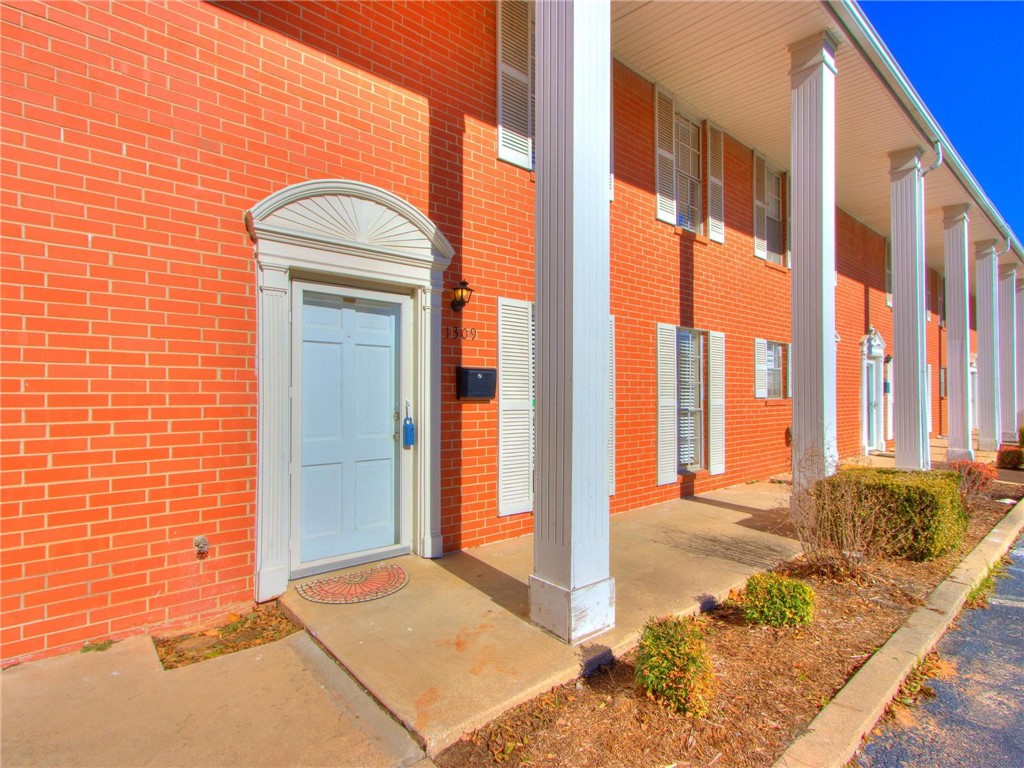Welcome home to this stylish, remodeled townhouse just minutes from The University of Oklahoma! The Columns is a six-unit boutique condominium development that provides urban living close to restaurants, shopping, I-35, and the University campus! A large living room greets you upon entering the unit. The dining room connects the living room to the kitchen, allowing for perfect flow for entertaining. Upgraded sleek kitchen cabinetry is complimented by stainless steel appliances, quartz countertops, and penny-round tile backsplash. Wood-look tile flooring can be found throughout the ground floor. A first floor bedroom and bath allow for flexible uses. A fenced backyard with patio is the perfect place to unwind in the evenings, or cookout with family and friends. Upstairs you will find 2 good sized bedrooms with engineered hardwood floors adjoined by a full bath with modern cabinetry, upgraded fixtures, and updated tile. Make this townhouse your next home or investment!