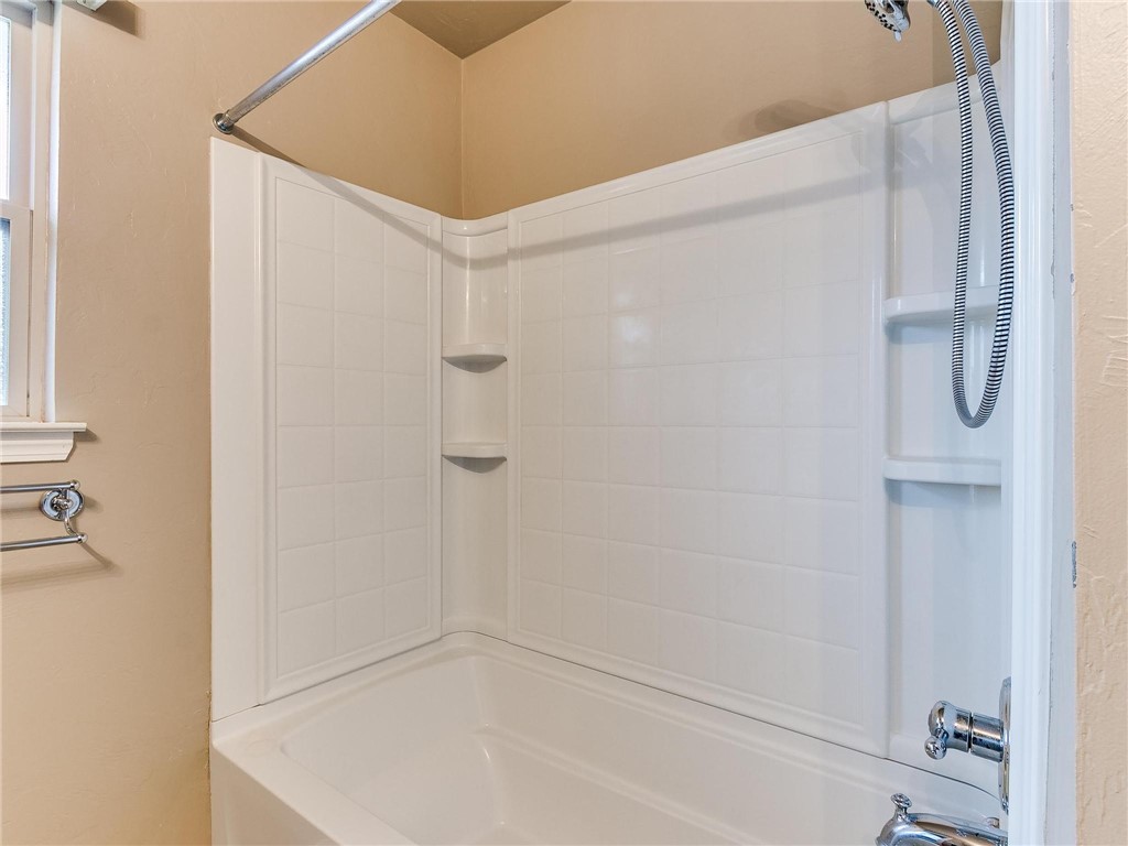 8605 SW 45th Terrace, Oklahoma City, OK 73179 bathroom with washtub / shower combination