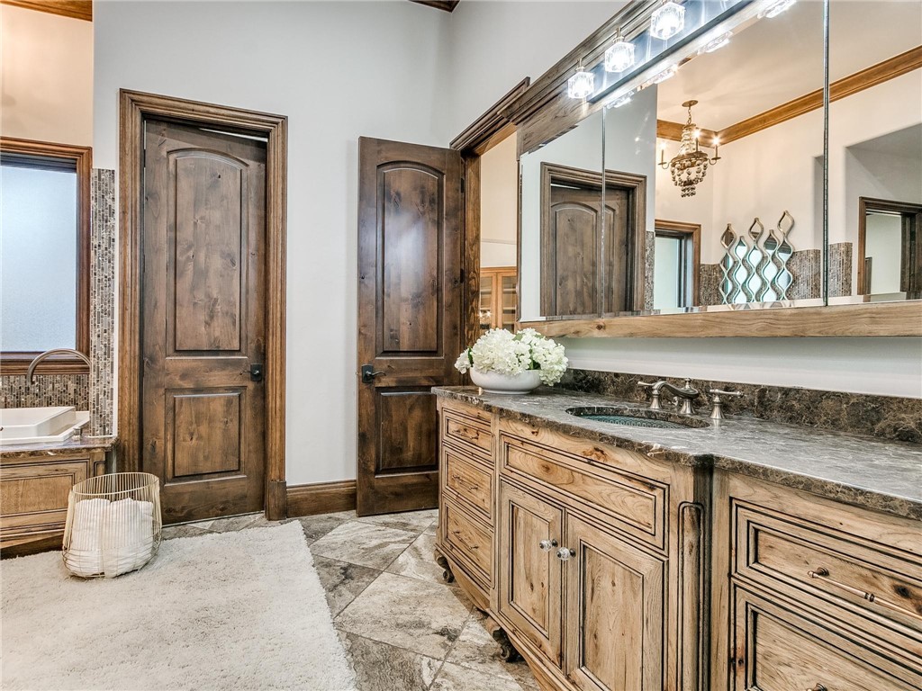 11649 Mill Hollow Court, Oklahoma City, OK 73131 bathroom with tile flooring, vanity, mirror, and a bathing tub