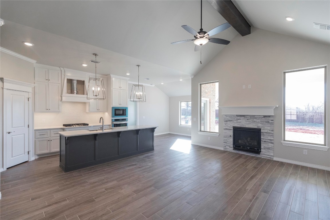 This Sage floor plan features 2,105 Sq Ft of total living space, which includes 1,850 Sq Ft of indoor living space & 255 Sq Ft of outdoor living space. Home offers 4 bedrooms, 2 full baths, 2 covered patios, a utility room, & a 3-car garage w/ a storm shelter installed. Living room presents a beautiful cathedral ceiling, large windows, wood-look tile, a ceiling fan, & a barndoor. Kitchen supports stainless steel appliances, 3 CM countertops, pendant lighting, a corner pantry, cabinets to the ceiling, more wood-look tile, & a center island. Primary suite welcomes a sloped ceiling detail, windows, a ceiling fan, & our cozy carpet finish. Prime bath has a dual sink vanity, a Jetta Whirlpool tub, a walk-in shower, a private toilet, & a HUGE walk-in closet. Outdoor living welcomes a wood-burning fireplace, a gas line, & a TV hookup for your flatscreen. Other amenities include our healthy home technology, a tankless water heater, a whole home air filtration system, R-44 insulation, & more!