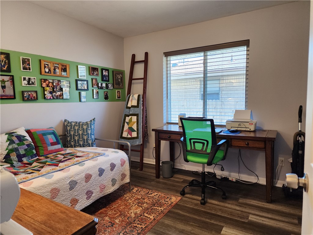 5604 N Roff Avenue, Oklahoma City, OK 73112 hardwood floored bedroom with natural light