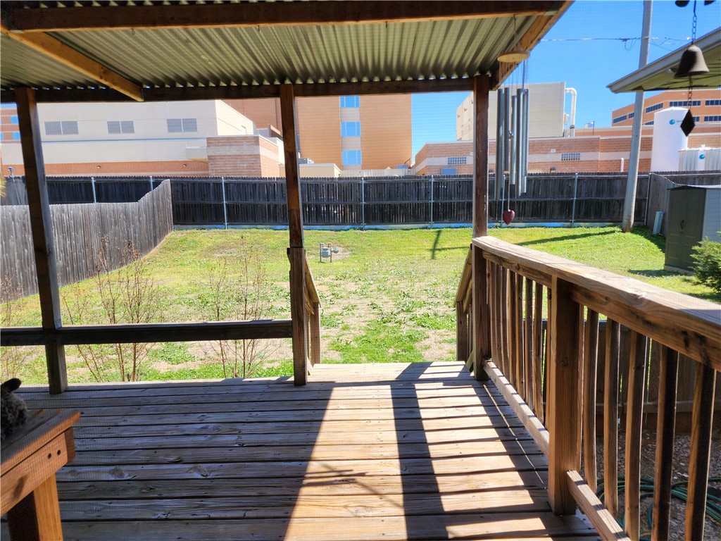 5604 N Roff Avenue, Oklahoma City, OK 73112 wooden terrace with a yard
