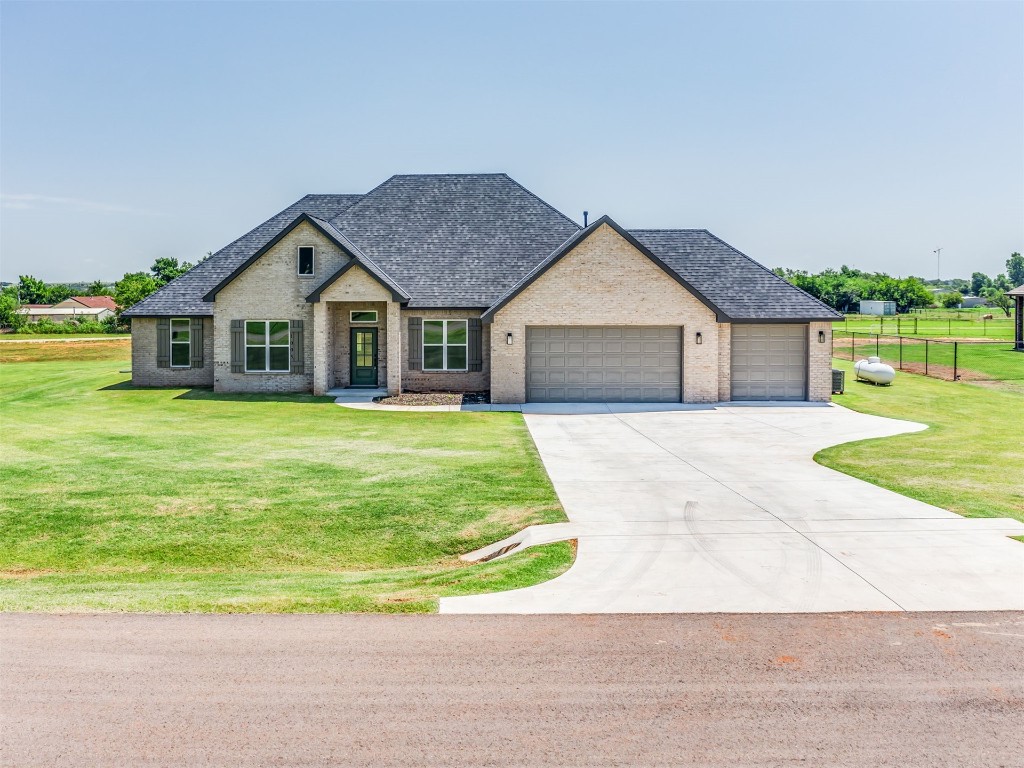 1005 Heritage Hills Drive, Tuttle, OK 73089 french provincial home with a front yard