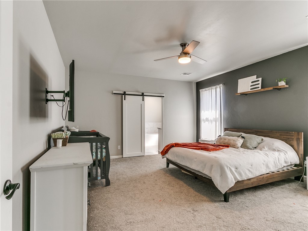 13304 Brampton Way, Yukon, OK 73099 carpeted bedroom with natural light and a ceiling fan