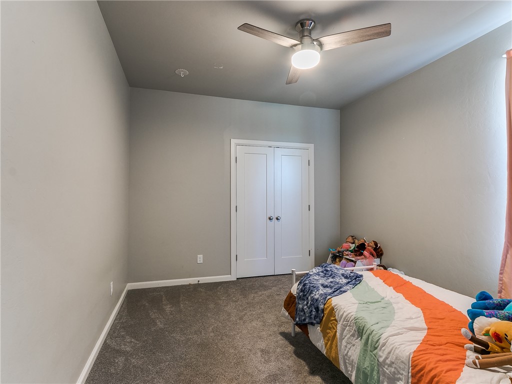 13304 Brampton Way, Yukon, OK 73099 carpeted bedroom featuring a ceiling fan
