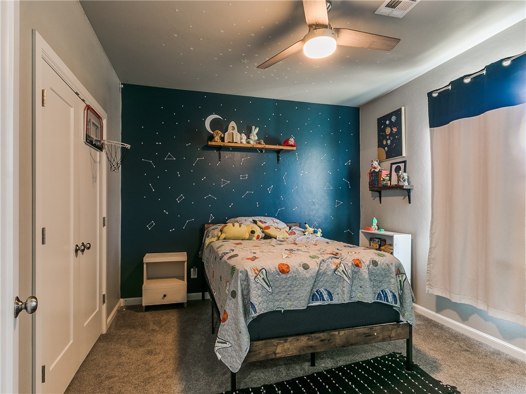 13304 Brampton Way, Yukon, OK 73099 carpeted bedroom with a ceiling fan