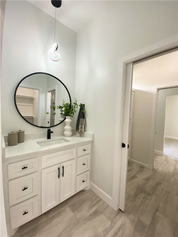 2441 SW 127th Street, Oklahoma City, OK 73170 bathroom with tile flooring, mirror, and vanity