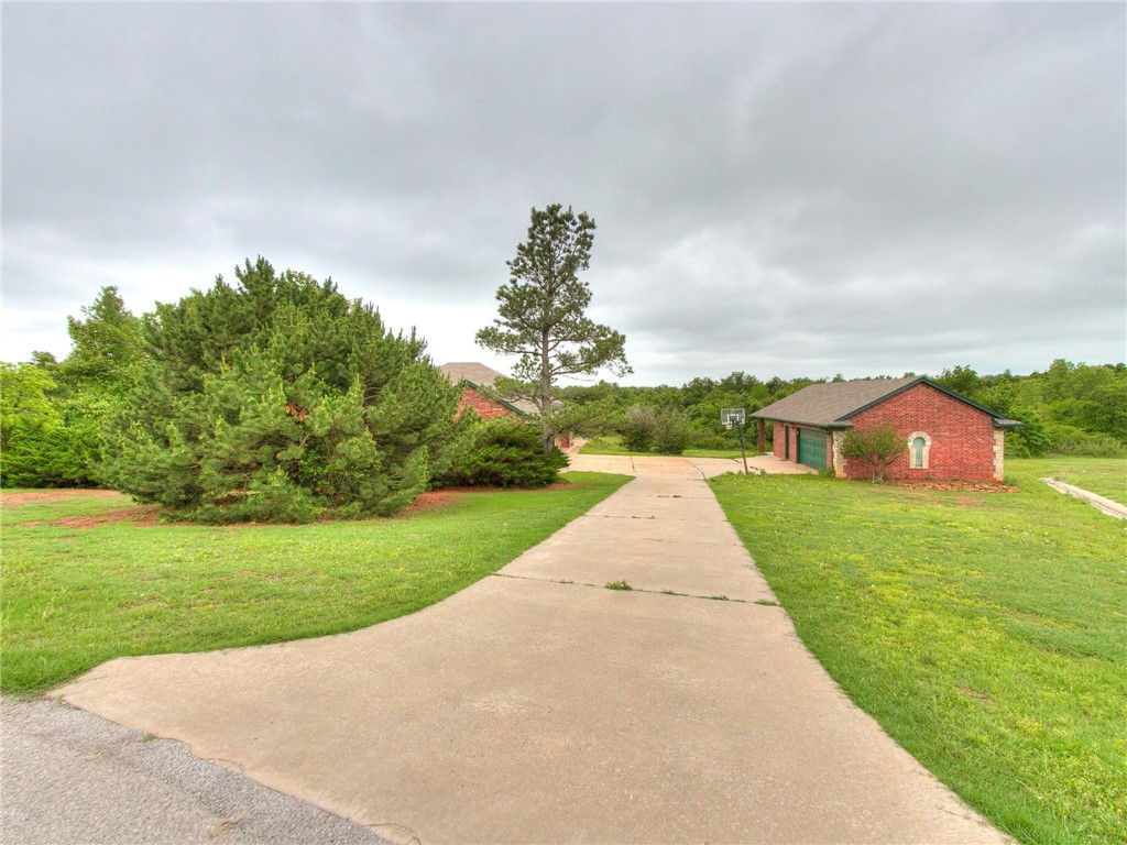 4023 Kittyhawk Drive, Blanchard, OK 73010 exterior space with a front yard