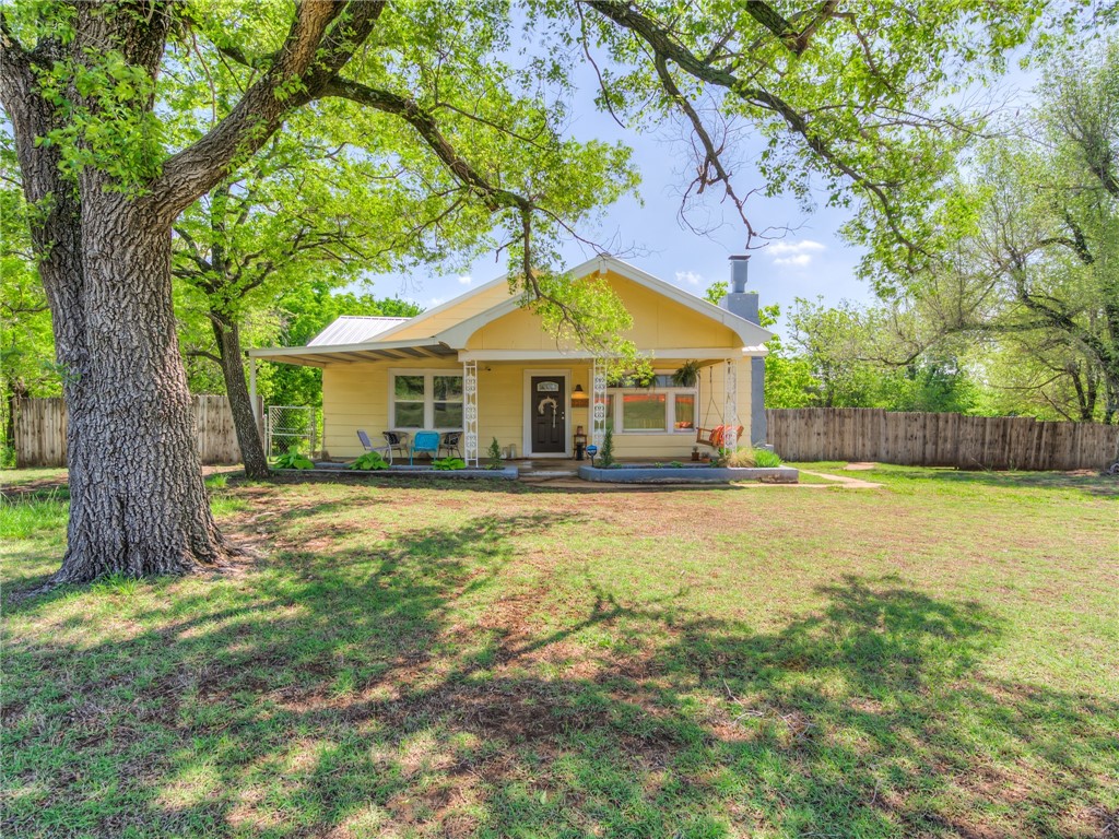 *MULTIPLE OFFERS HIGHEST AND BEST DUE 5/11 AT 9PM.* 
Gorgeous 1950s era home just on the edge of Oklahoma City with a spacious open floor plan, original fireplace and impeccable large windows that flood the home with natural light. The updated kitchen and bathrooms give a modern touch to this vintage beauty. The large primary en-suite has it's own back deck with a stunning view of the property. With brand new light fixtures, windows, HVAC and a new shop built last year, this spot is perfectly updated without removing the mid century charm. With a large covered front porch and an acre all to yourself, you could spend your evenings tucked away in the trees in this little slice of heaven.