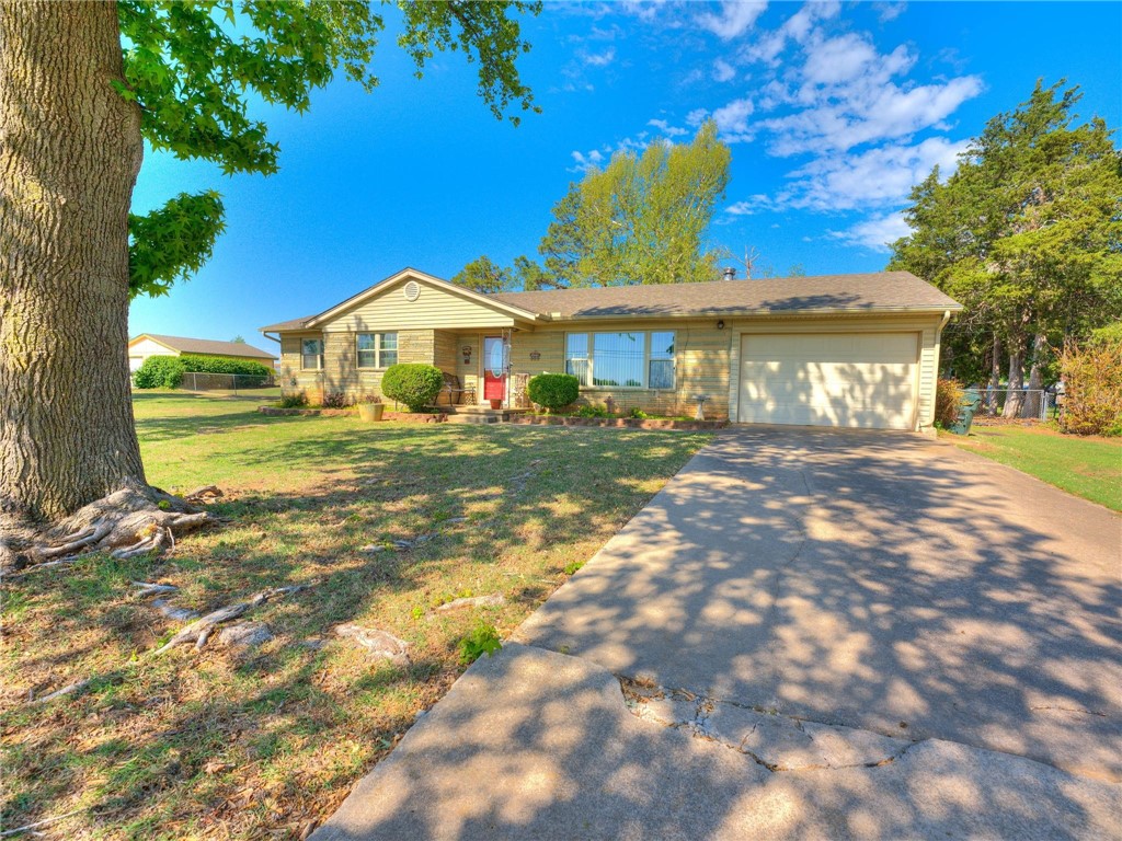 Don't miss your chance to own this very well cared for 3 bed 2 bath home located on 1.7 acres with a workshop and additional outbuildings.  Home features a storm shelter, fenced private vegetable garden area, covered back patio and very large fenced in acreage.