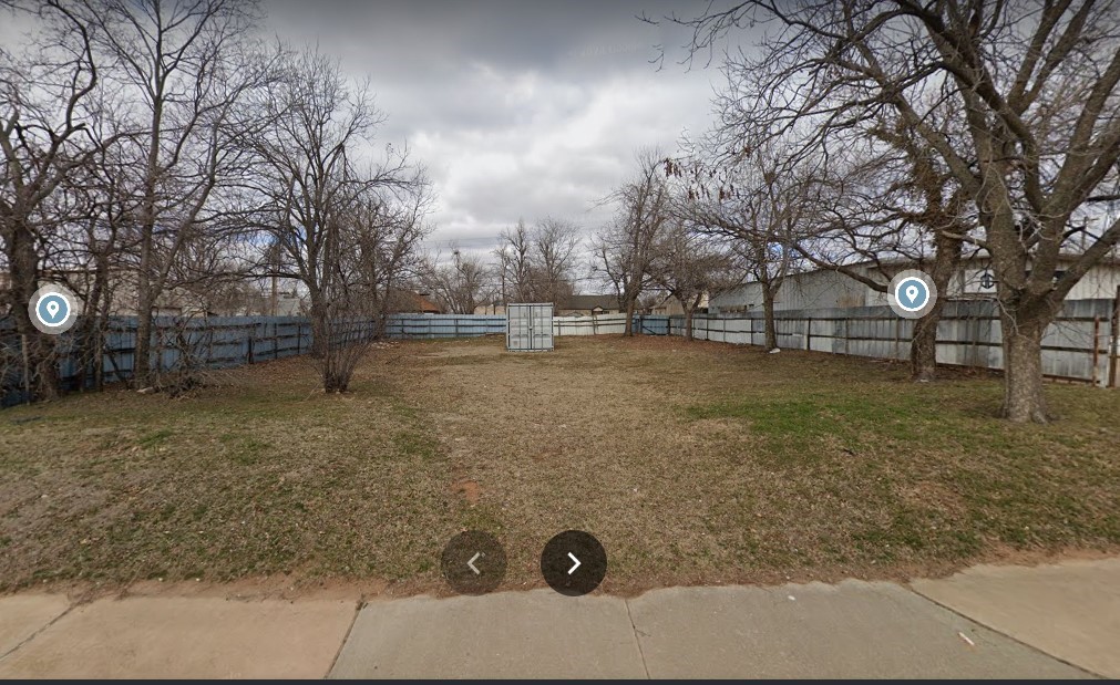 This is a vacant commercial lot.It is currently zoned residential, however it is between two commercial buildings.