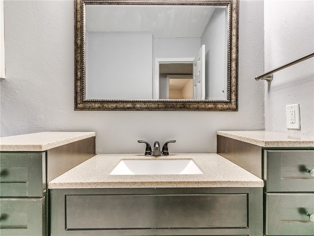14407 N Pennsylvania Avenue, #12P, Oklahoma City, OK 73134 bathroom featuring oversized vanity and mirror
