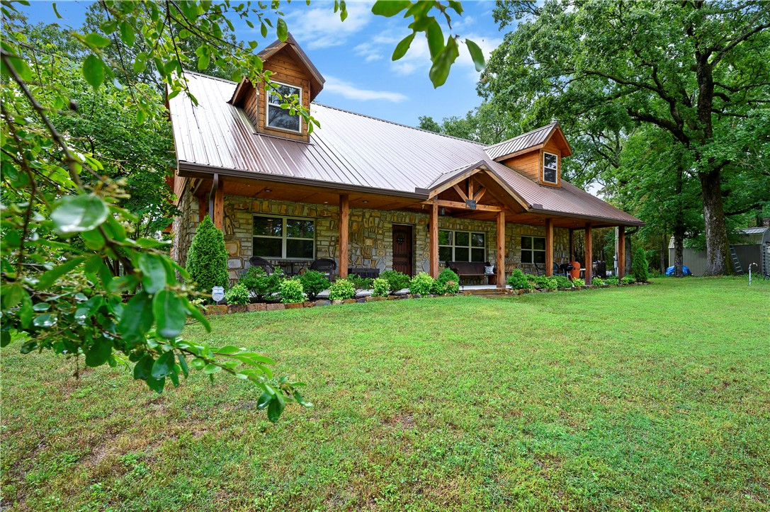 Rare four bedroom cabin, with a peekaboo view of the Mountain Fork River. If this extremely well built second home had a name it would be “Labor of Love”. It was custom built in 2019 but the owners. The only original part of this home are the gorgeous stone walls and was rebuilt from the ground up. One of the best built homes in McCurtain County. The property line does not go down quite down to the river, but with a little manicuring this property would have a gorgeous view of the river and could have a walking path to the river! Downstairs are two master bedrooms, and two full bathrooms one with a jetted tub. There is an extra room off the dining room that could be used as a bunk room. The second floor has two sleeping areas and a half bathroom both with nooks that could also fit bunkbeds. This home comes fully furnished and it is outfitted ready for a wood-burning stove. Tons of closet space upstairs and too many amenities to list!