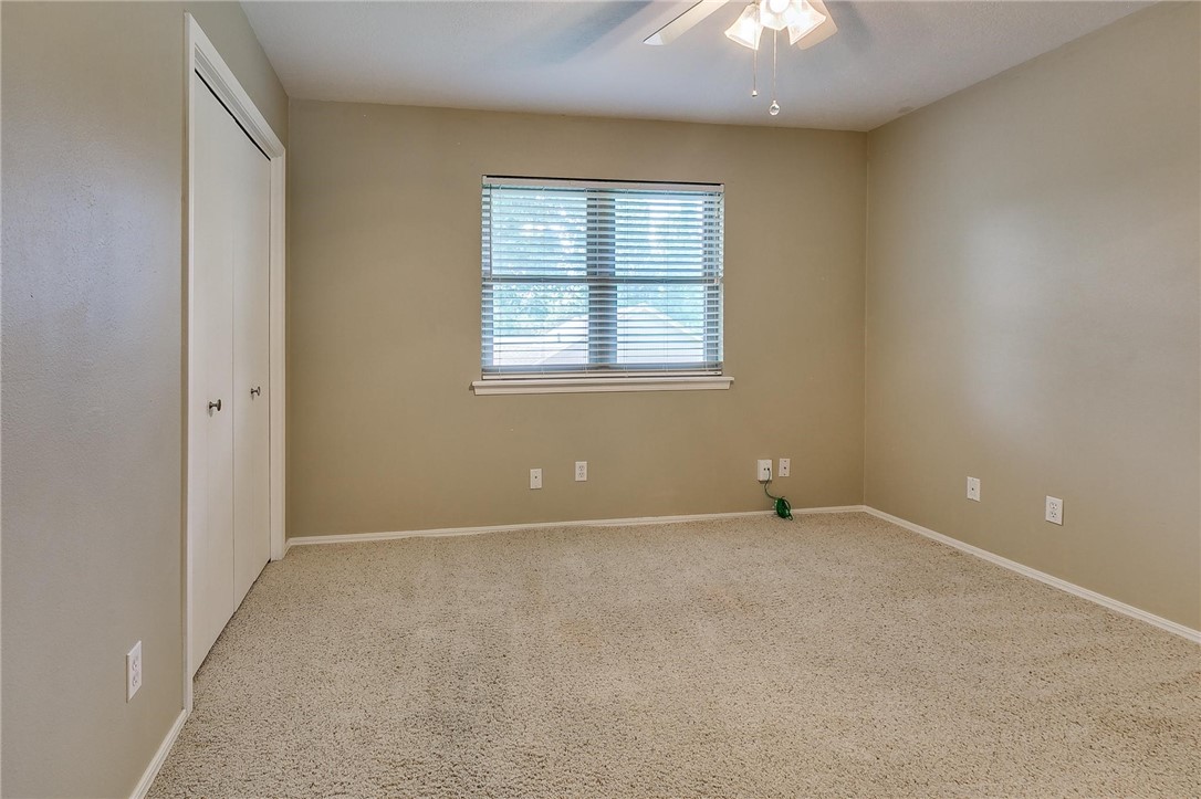 3815 Marked Tree Drive, Edmond, OK 73013 carpeted spare room featuring natural light