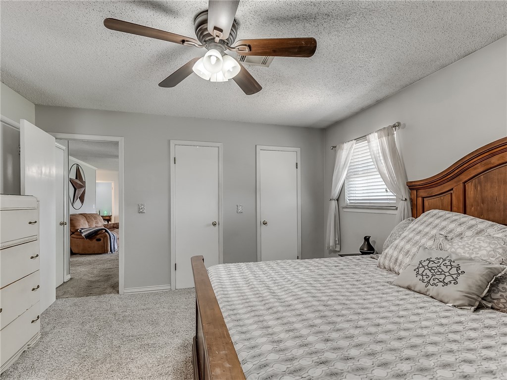 8909 Kenny Circle, Oklahoma City, OK 73132 bedroom featuring carpet and a ceiling fan