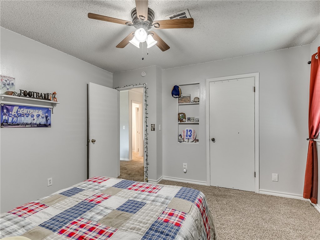 8909 Kenny Circle, Oklahoma City, OK 73132 bedroom featuring a ceiling fan and carpet
