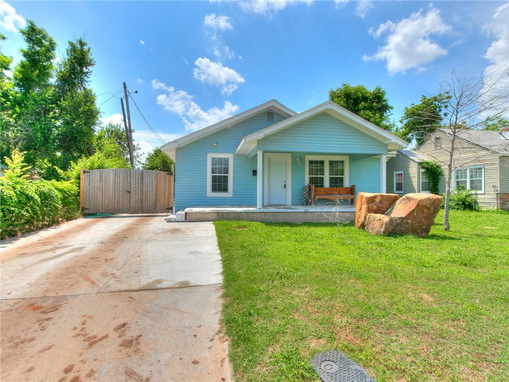 2115 N Jordan Avenue, Oklahoma City, OK 73111 bungalow-style home featuring a front yard