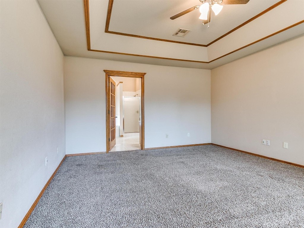 201 Pinafore Drive, Norman, OK 73072 empty room with carpet and a ceiling fan