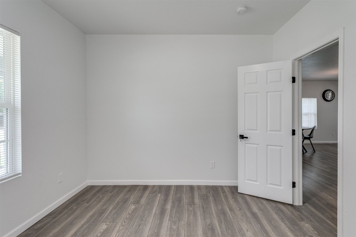 615 E Gray Street, Norman, OK 73071 empty room with plenty of natural light and hardwood floors