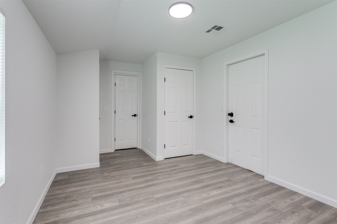 615 E Gray Street, Norman, OK 73071 spare room with hardwood flooring