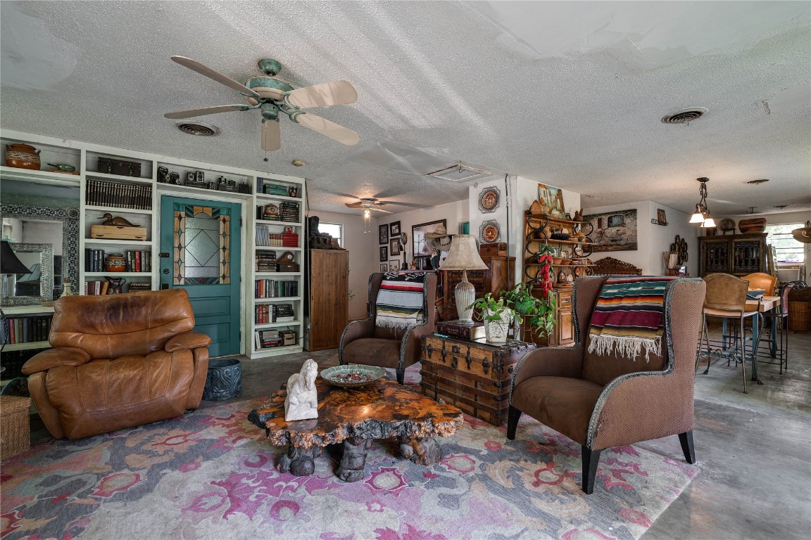 12345 SW 42nd Street, Mustang, OK 73064 living room featuring a ceiling fan