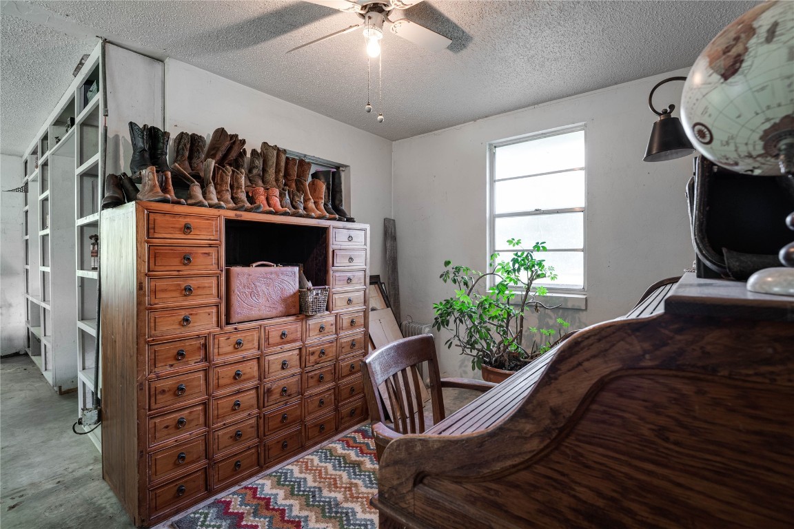 12345 SW 42nd Street, Mustang, OK 73064 bedroom featuring a ceiling fan, natural light, and carpet